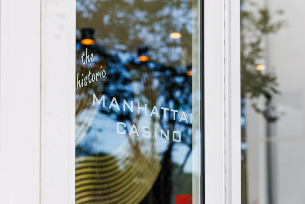 sign on window of the historic manhattan casino